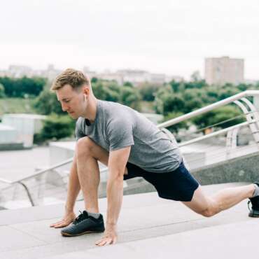 Man stretching before workout and running. Sport fitness and healthy lifestyle