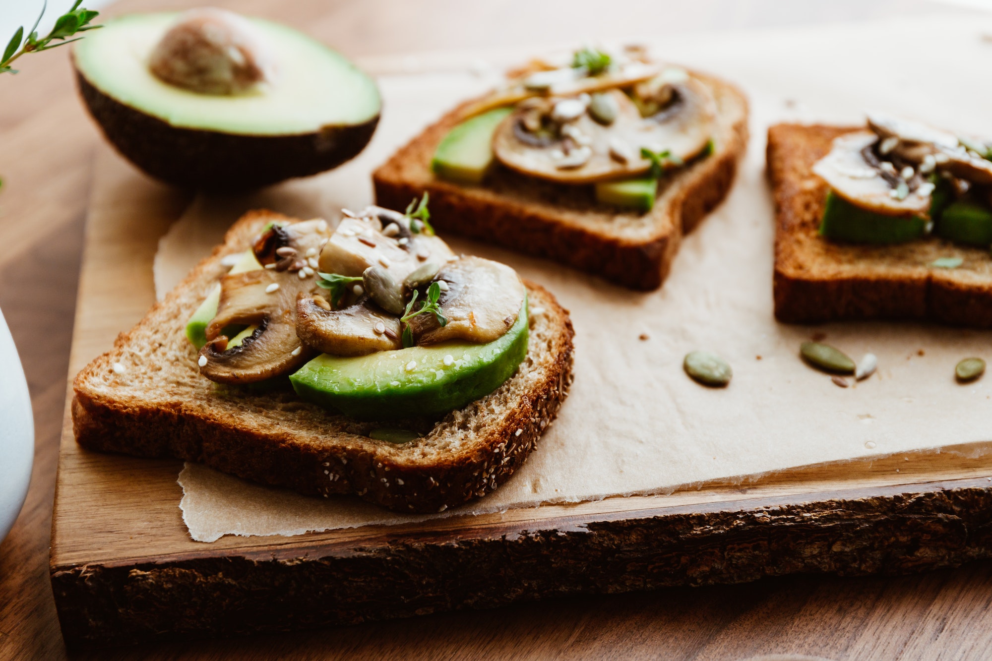 Toasts with fried mushrooms and avocado. Healthy fitness food.