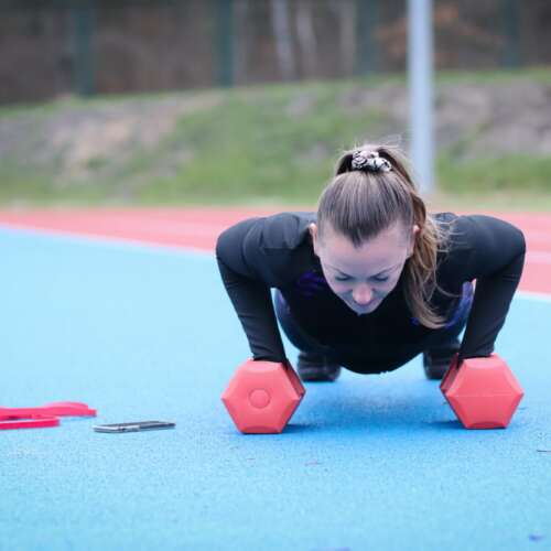 Young woman doing sports at the stadium. Outdoor activities,fitness,body building,healthy life style