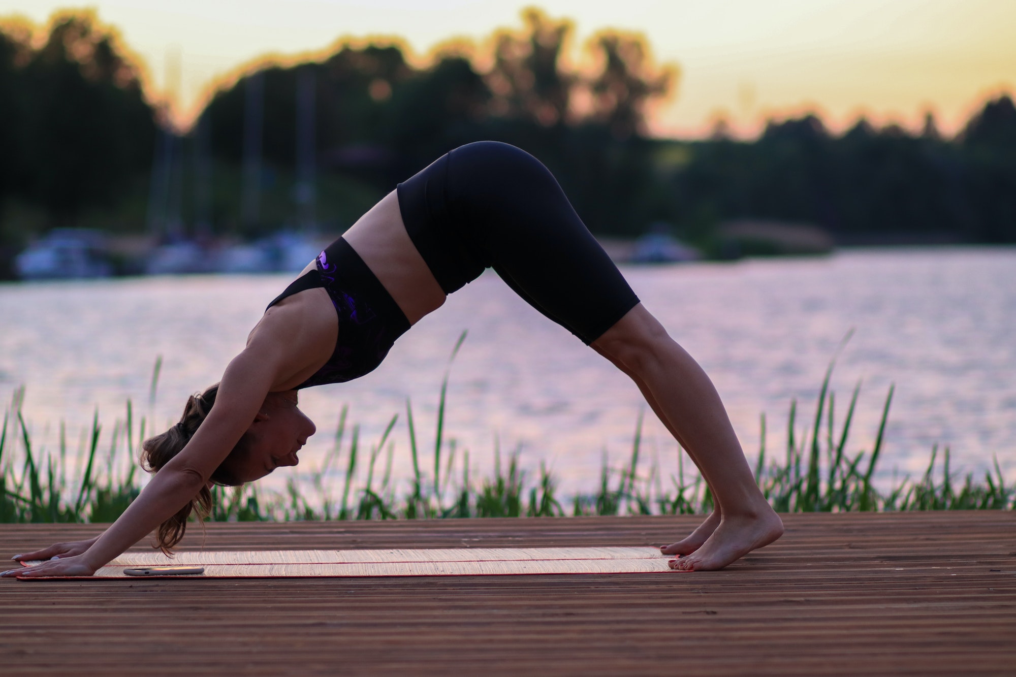 Young woman exercising outside.Summer time, body building, fit, fitness, healthy life, exercise.